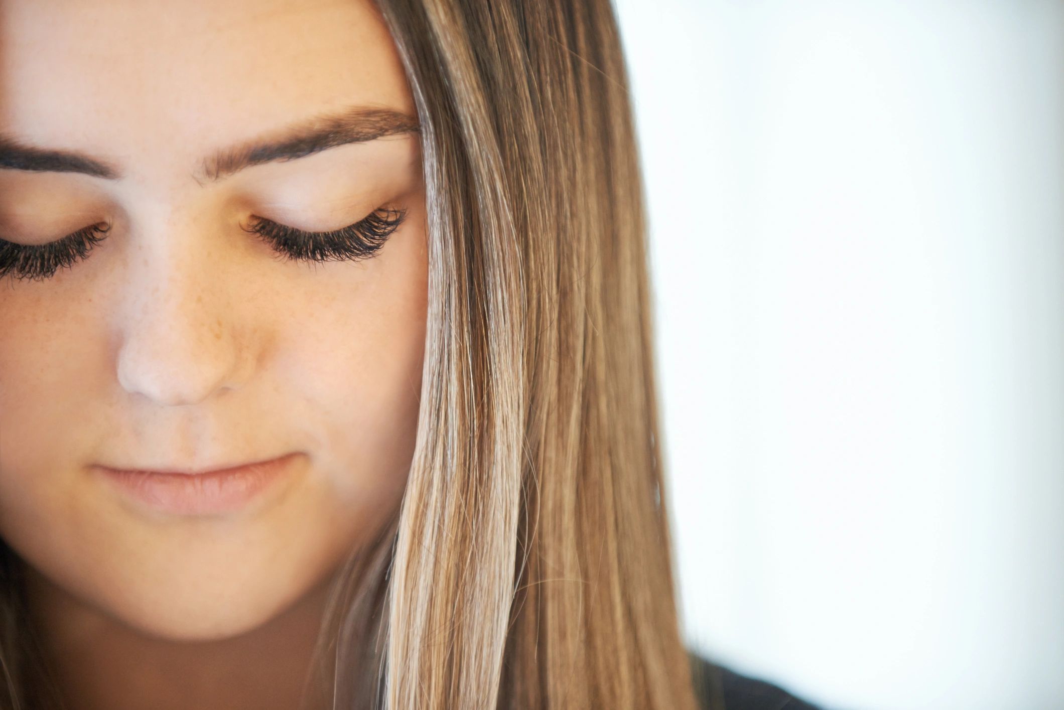 Close-up of a woman wearing natural-looking eyelash extensions